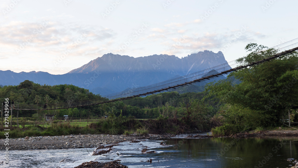 Suspension bridge with Mt. Kinabalu on the background.