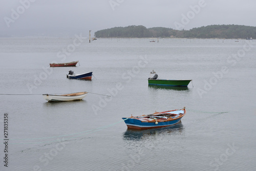 wooden fishing boats moored in the sea
