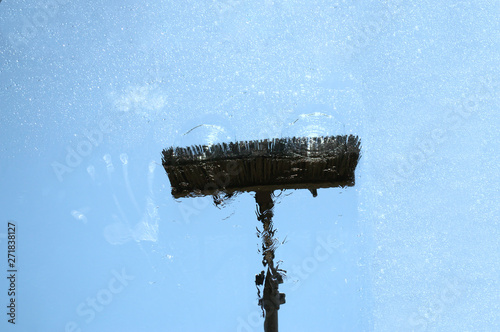 Window glass cleaning with pure water and extension pole. Washing and rinse using a reach and wash system.