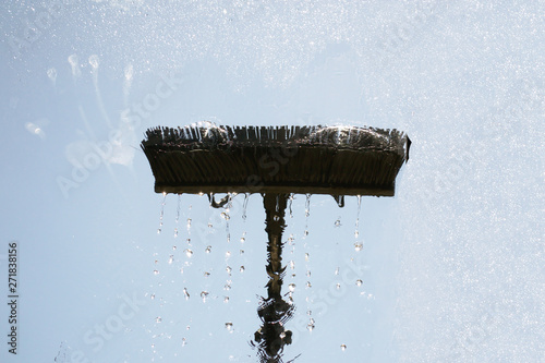 Window glass cleaning with pure water and extension pole. Washing and rinse using a reach and wash system.