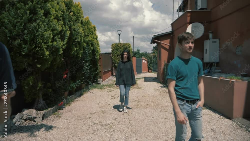 concept of solitude of the people.a young woman walks between motionless people