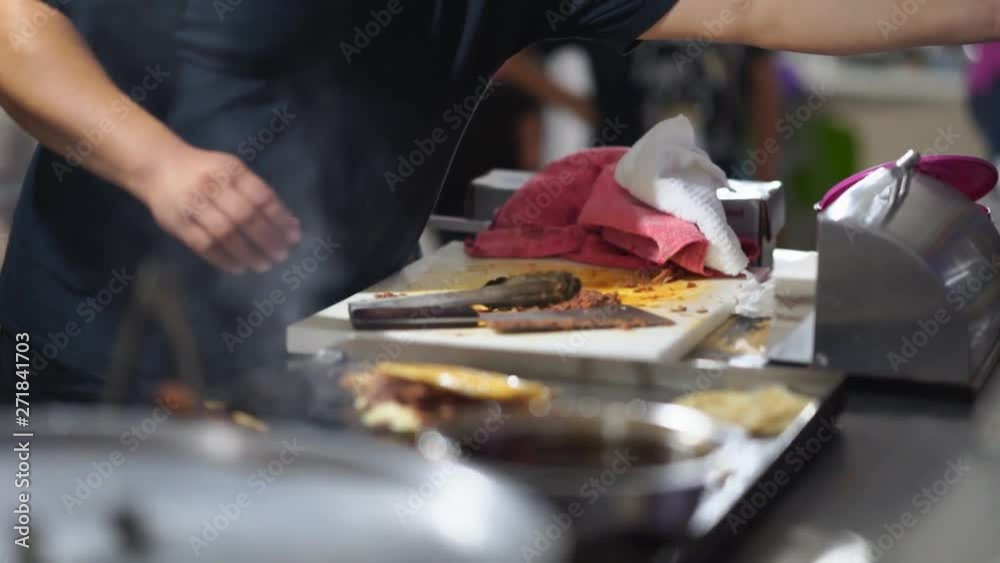 Traditional preparation of Mexican street tacos in Baja California during fiesta celebration of national independence