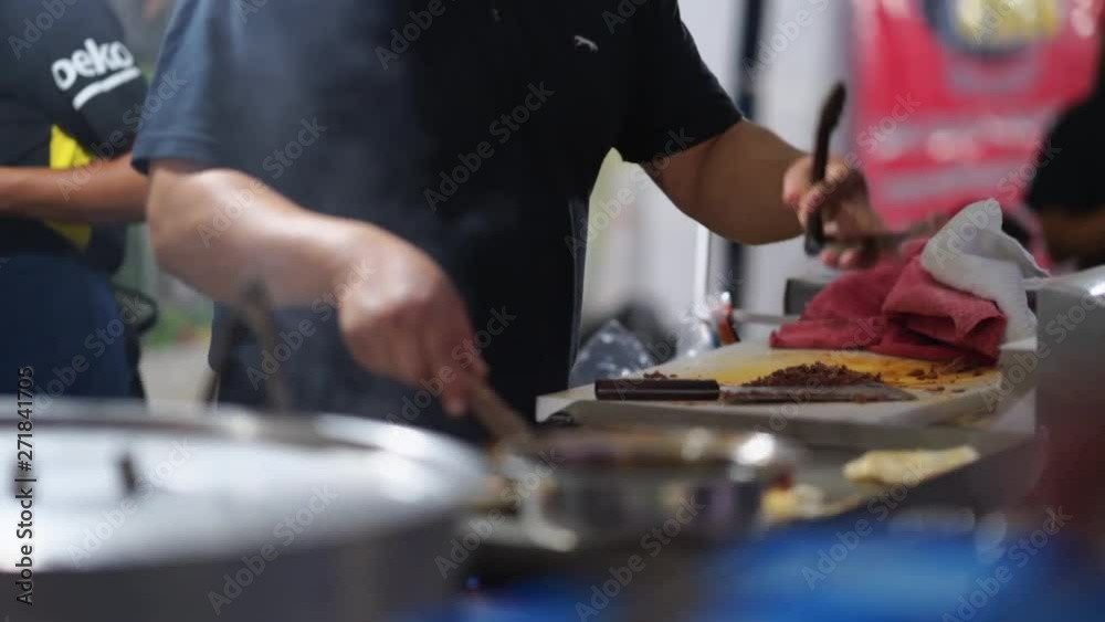Traditional preparation of Mexican street tacos in Baja California during fiesta celebration of national independence