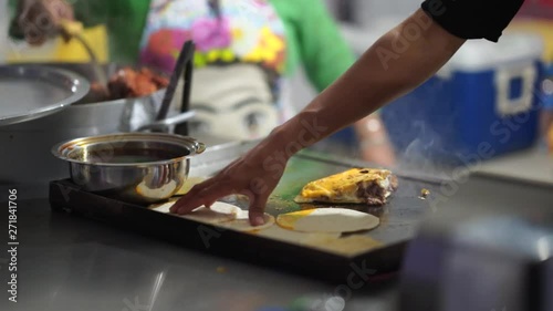 Traditional preparation of Mexican street tacos in Baja California during fiesta celebration of national independence photo