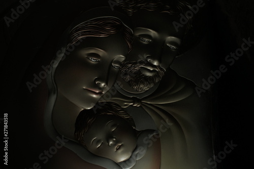 Portrait of a holy family on a dark background photo