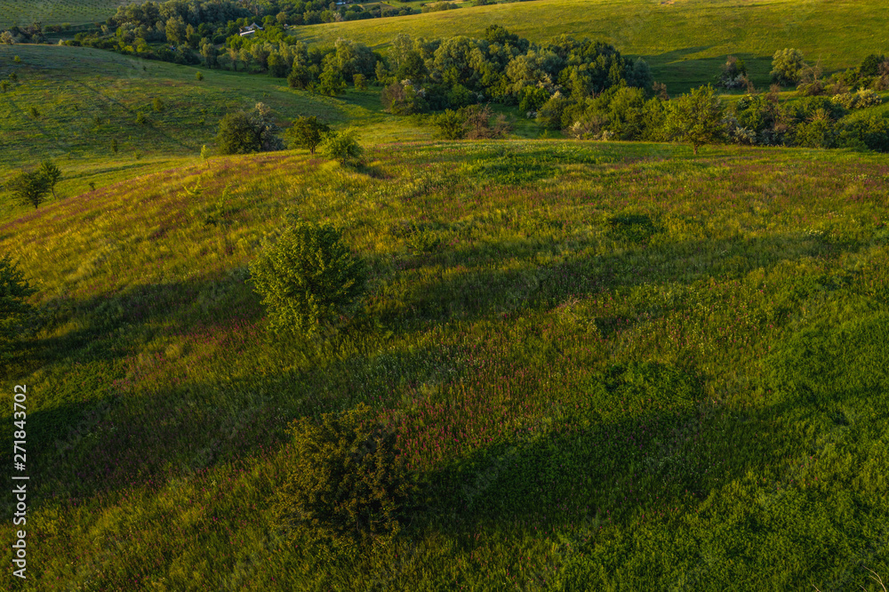 Obraz premium Hilly landscape on sunset time