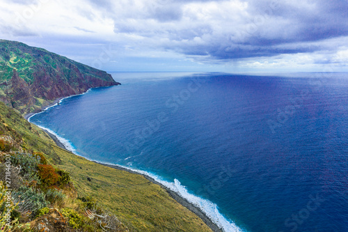 Rocky coast of Atlantic ocean at Madeira archipelago in Portugal at cloudy day