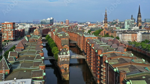 Hamburg Hafencity. Weltkulturerbe Speicherstadt mit Wasserschloss und Elbphilharmonie. Luftaufnahme photo