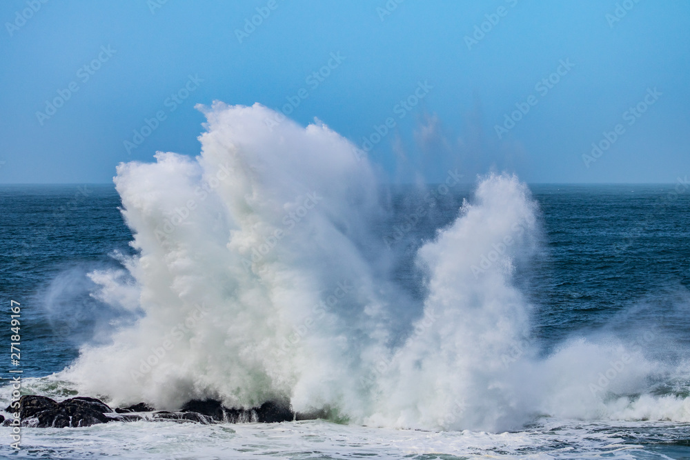 waves crashing on rocks