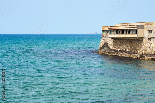 Abandoned old building on a sea coast of Heraklion, Crete, Greece.
