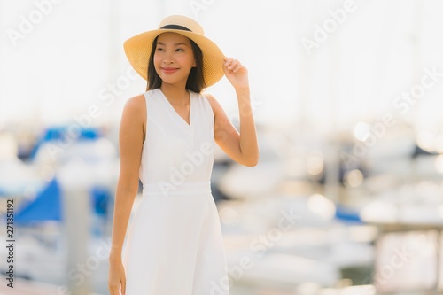 Portrait beautiful young asian woman leisure smile happy relax around yacht port © siraphol