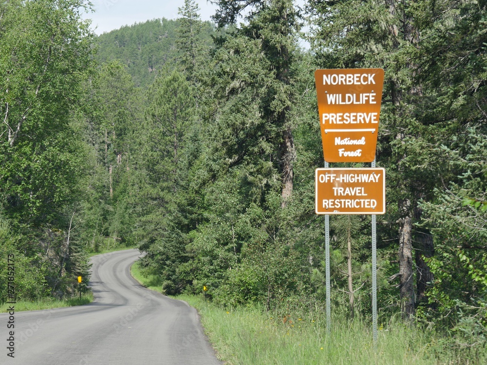 Roadside signs and warnings at Norbeck Wildlife Preserve National Forest, Custer State Park, South Dakota.