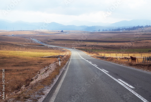 Road between hills at sunset time,travel concept
