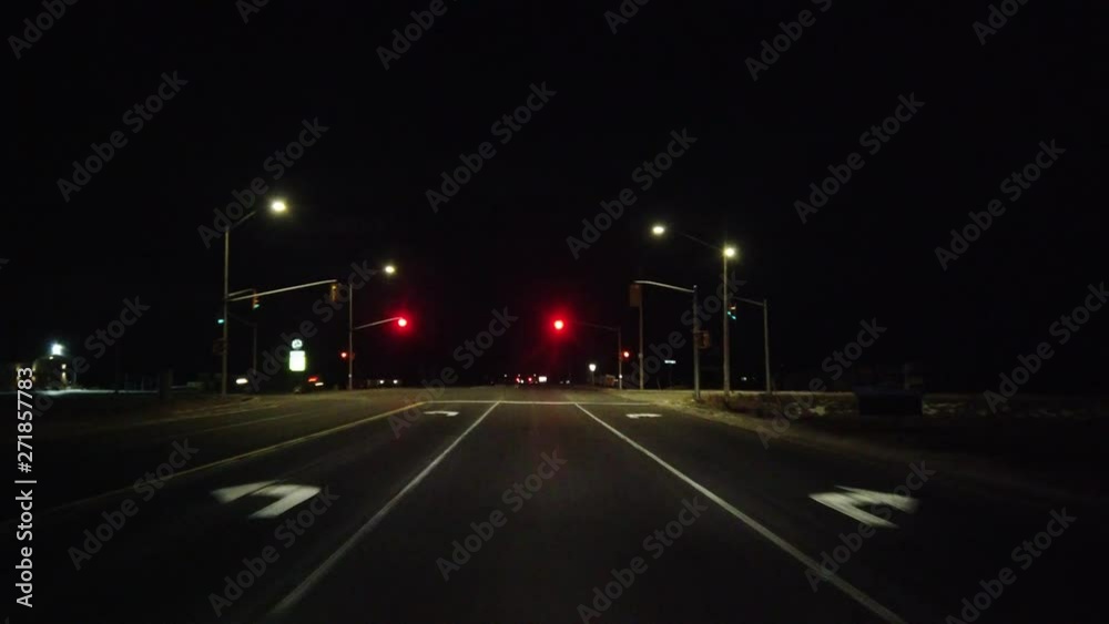 Driving Down Country Road And Stopping At Red Light In Evening With Clear Midnight Black Sky Driving Down Country Road And Stopping At Red Light In Evening With Clear Midnight Black Sky