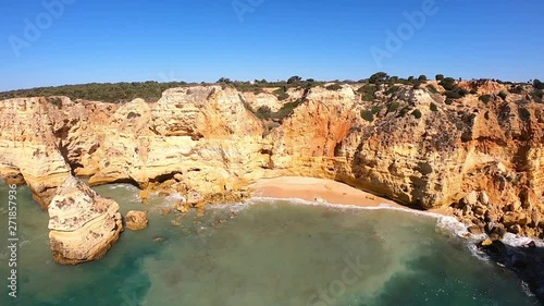 Aerial view on Praia de Marinha, most beautiful beach in Algarve Portugal. View from above on coast of Atlantic Ocean. 