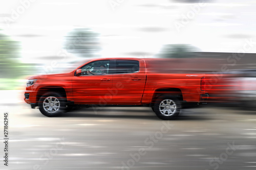 red car on the road