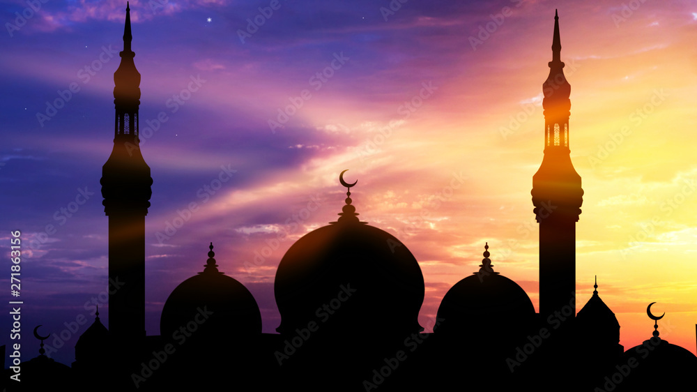 Fototapeta premium Mosque silhouette view . Generous Ramadan . An Islamic crescent on top of a mosque