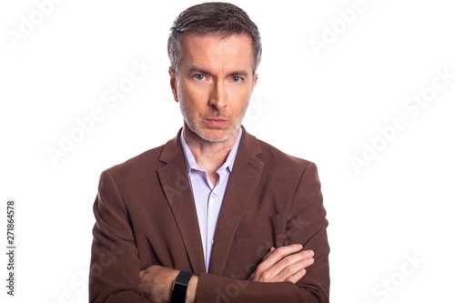 Billede på lærred Middle aged bearded businessman on a white background wearing a brown jacket