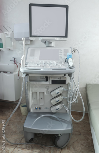 Modern ultrasound machine in clinic, space for text