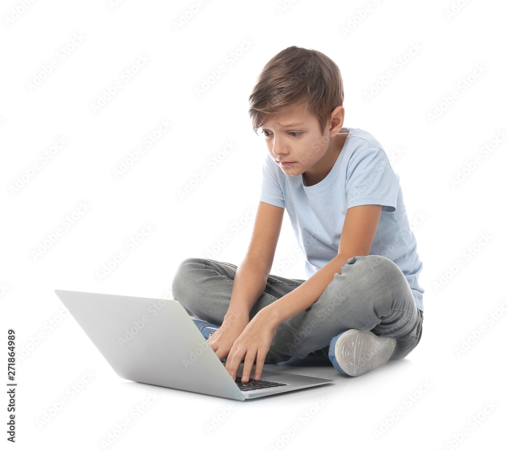 Shocked child with laptop on white background. Danger of internet Shocked child with laptop on white background. Danger of internet