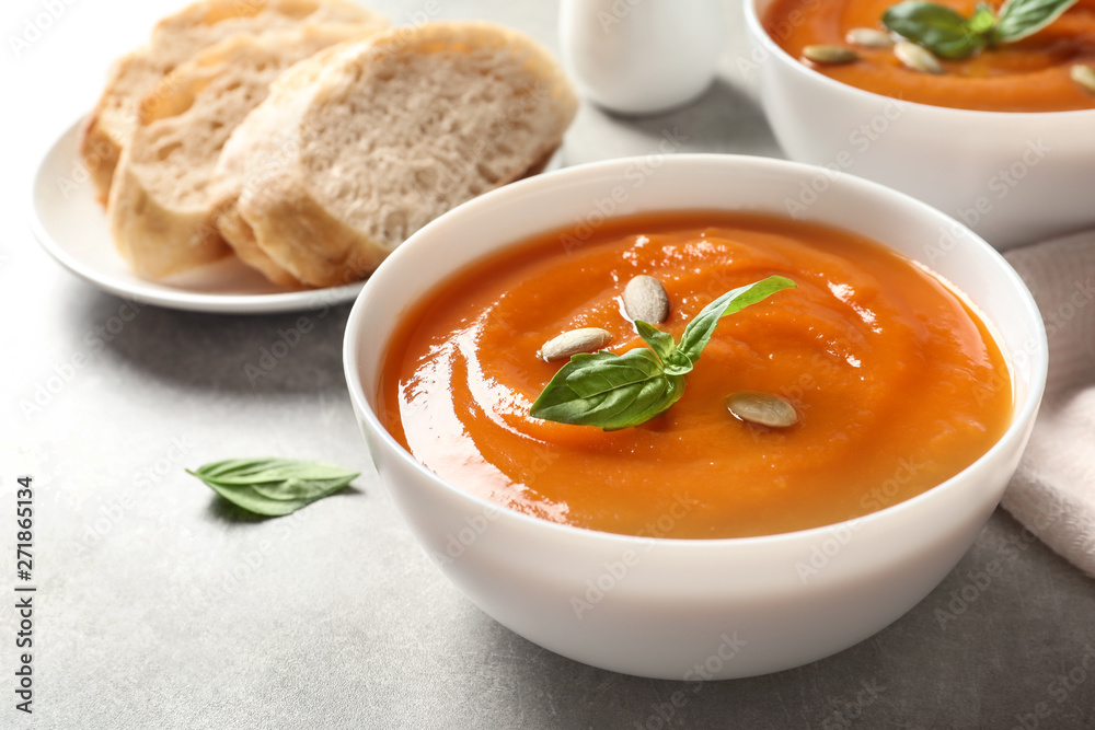 Bowl of tasty sweet potato soup on table Bowl of tasty sweet potato soup on table