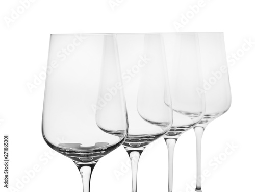 Empty clear wine glasses on white background