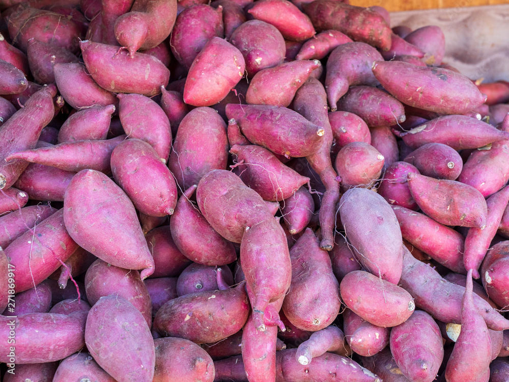 Pile of fresh yams at farmer market for sale Pile of fresh yams at farmer market for sale