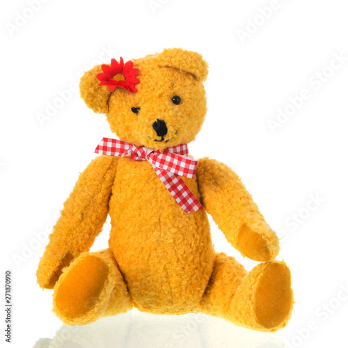 Stuffed toy bear with bow