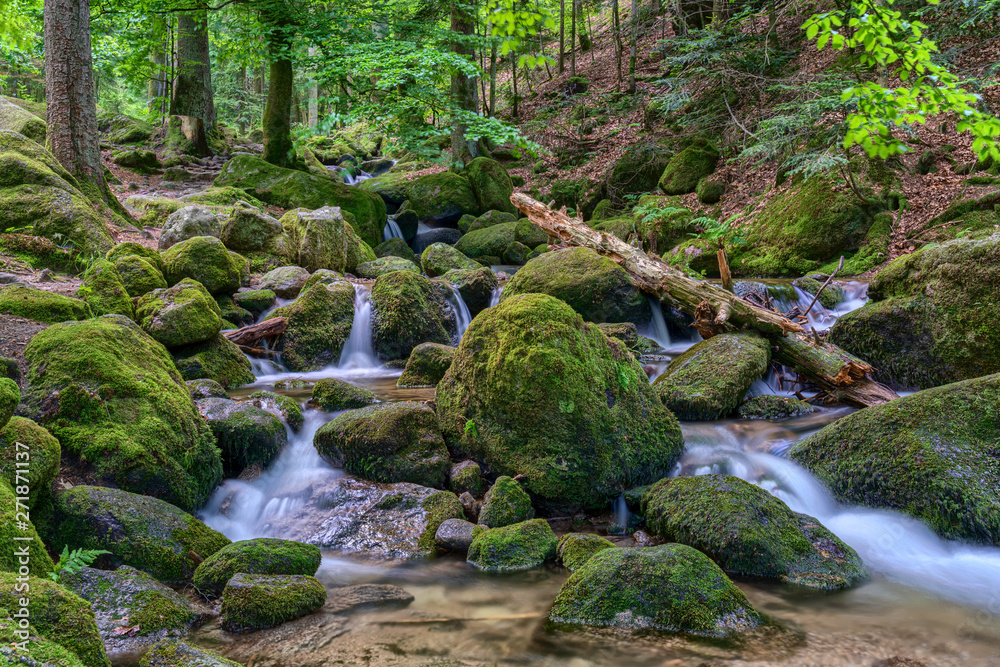 Water streaming over rocky cascades along famous Gertelbach waterfalls, Black Forest, Germany Water streaming over rocky cascades along famous Gertelbach waterfalls, Black Forest, Germany