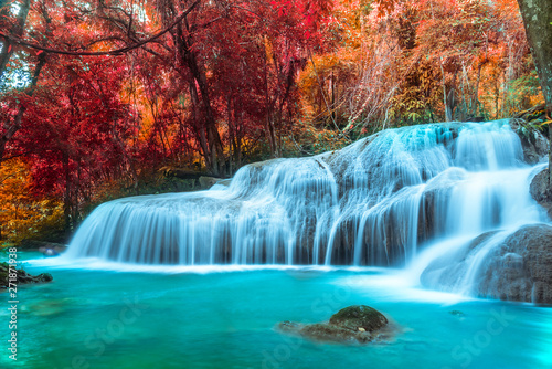 A Colorful forest in Autumn season Pha Tad Waterfall at Kanchanaburi Thailand is Amazing nature.