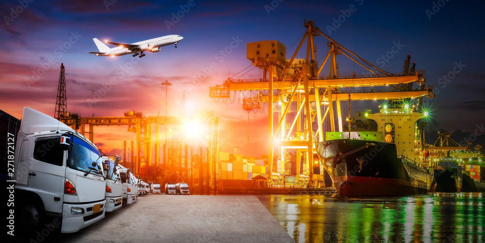 Container truck in ship port for business Logistics and transportation of Container Cargo ship and Cargo plane with working crane bridge in shipyard at sunrise, logistic import export and transport 