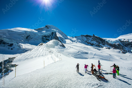 Allalin ski area is one of the longest ski runs in the Alps, that can be reached by a cable car and mountain train. Visible from a distance is the Allalinhorn, that lies above Saas-Fee in Switzerland. photo