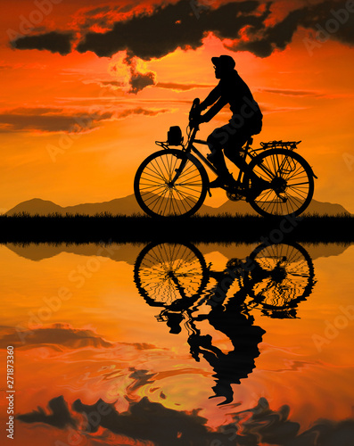 Cycling Silhouette on sunrise background © rathchapon