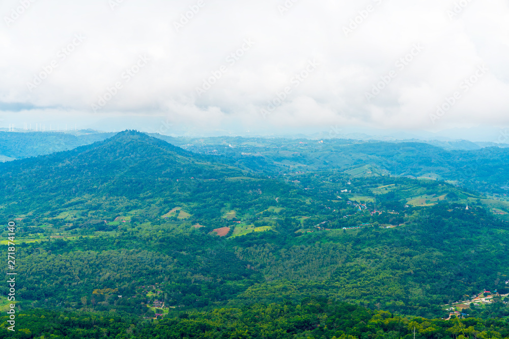 Fototapeta premium Blue sky high peak mountains fog hills mist scenery national park views at Phu Tub Berk, Khao Koh, Phetchabun Province, Thailand