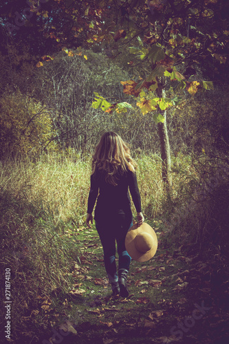 Woman walking down path