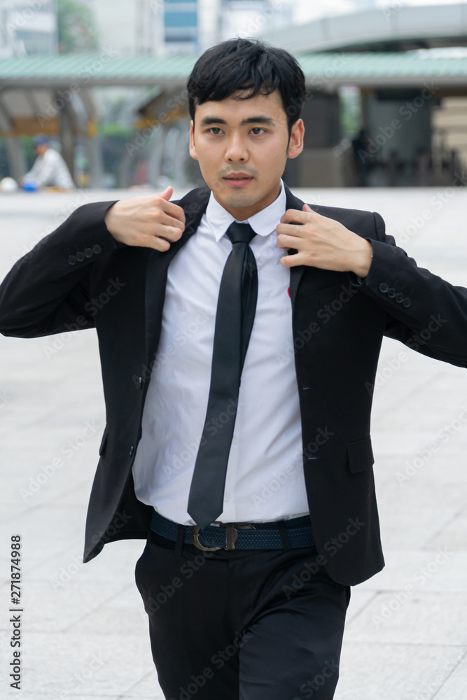 Asian business man wearing black suit. Asian business man wearing black suit.