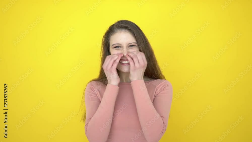 Surprised woman face. Portrait of fashion model happy teen girl wow expression. wondering shocked woman looking at camera on yellow background in studio. Shock girl portrait. emotions, good news, 4 K Surprised woman face. Portrait of fashion model happy teen girl wow expression. wondering shocked woman looking at camera on yellow background in studio. Shock girl portrait. emotions, good news, 4 K