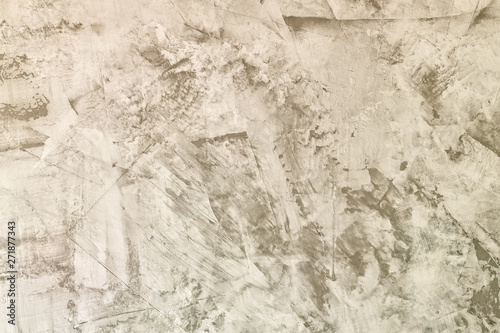 Abstract light gray background. Straya plaster wall with scratches and roughness. The basis for the layout. Light photo.