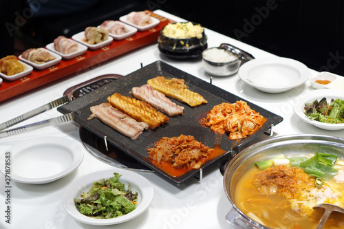 Korean grilled pork belly BBQ (Samgyeopsal Gui) - The popular Korean barbecue dish, served with fresh lettuce and a spicy dipping sauce.