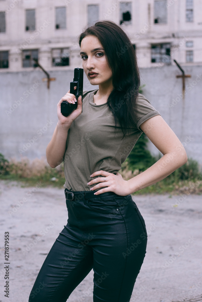 Powerful Woman Holding Gun Action Movie Style. Train adventure. Military girl with . Police girl. hot spot