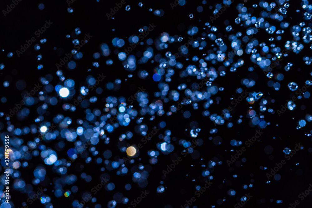 Abstract blue bokeh on black