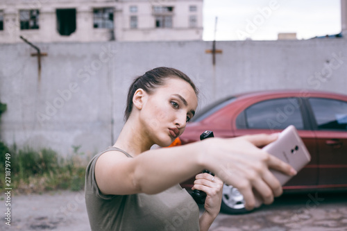 Powerful Woman Holding Gun Action Movie Style. Train adventure. Military girl with . Selfi girl.