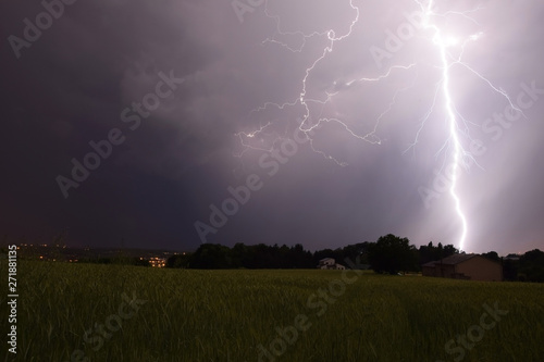 Powerful close lightning strike with heavy rain over fields and crops (Dordogne, France)