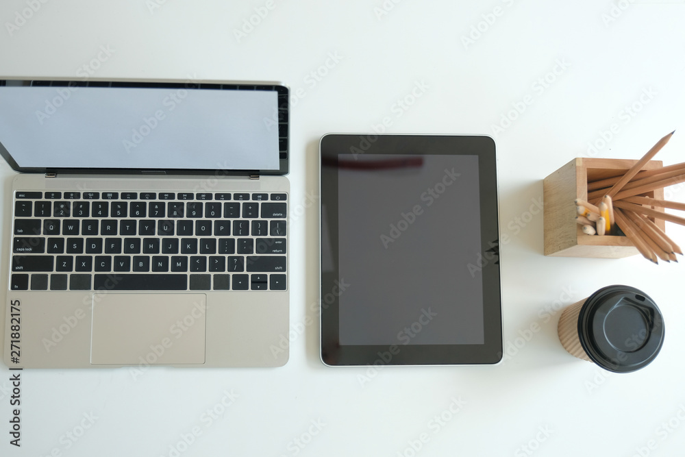 computer tablet pencil coffee cup on office desk. workplace interior computer tablet pencil coffee cup on office desk. workplace interior