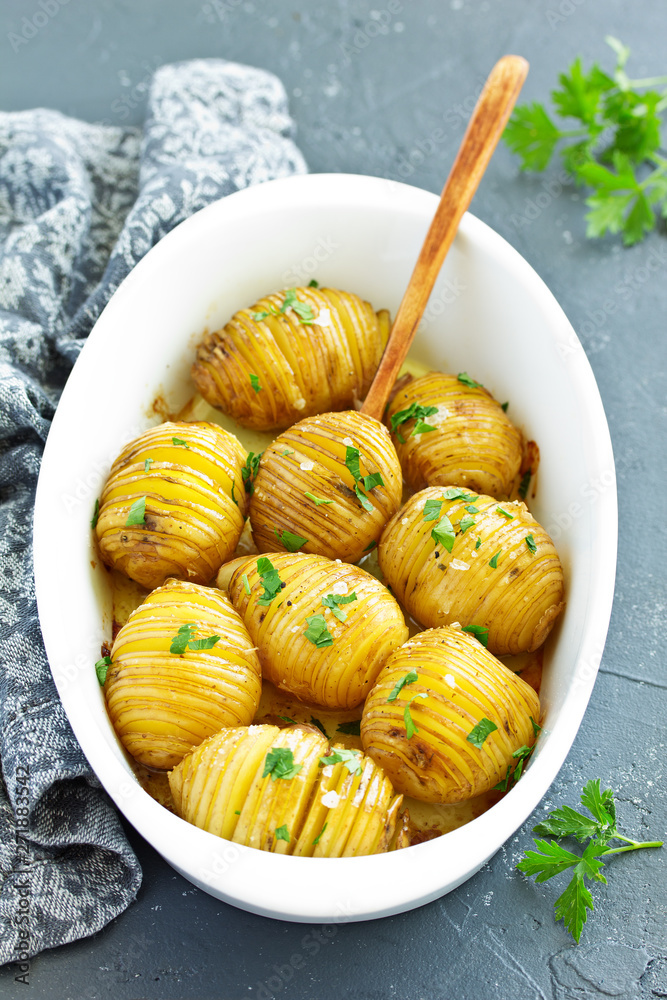 baked potato accordion with parsley. baked potato accordion with parsley.