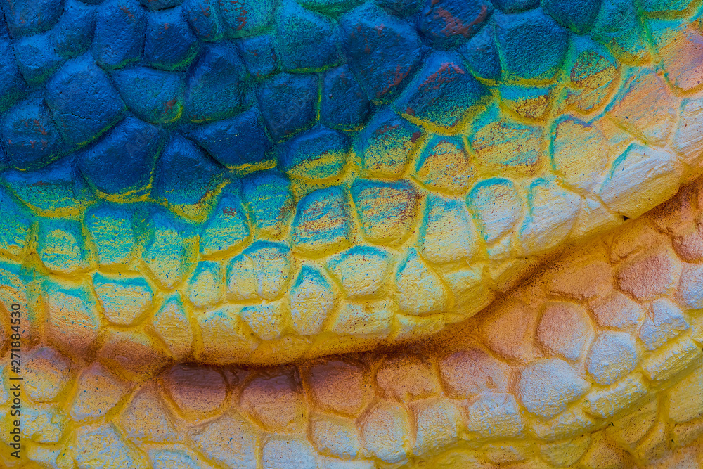 Close up to Colorful and patterns of dinosaur model surfaces created with cement Close up to Colorful and patterns of dinosaur model surfaces created with cement