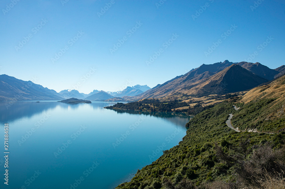 Gorgeous view of  blue calm lake surrounding with mountains from viewpoint on the way to Glennorchy in South Island, New Zealand.
