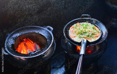 Cooking Vietnamese traditional seafood pancake