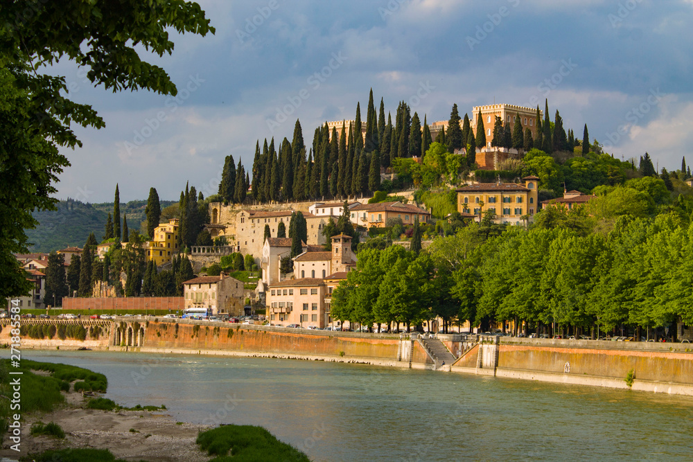 Verona, cityscape embankment view, Italy. Adige river that crosses Verona. Sunny day.