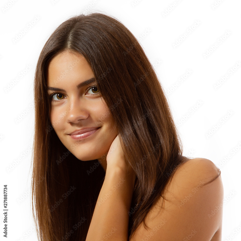 Beauty feminine portrait of female face with healthy natural skin. Beautiful tanned teen girl with long brown hair looking at camera. Pretty attractive young woman posing at studio, isolated on white Beauty feminine portrait of female face with healthy natural skin. Beautiful tanned teen girl with long brown hair looking at camera. Pretty attractive young woman posing at studio, isolated on white
